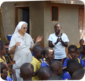 A Sister and teacher with students in South Sudan